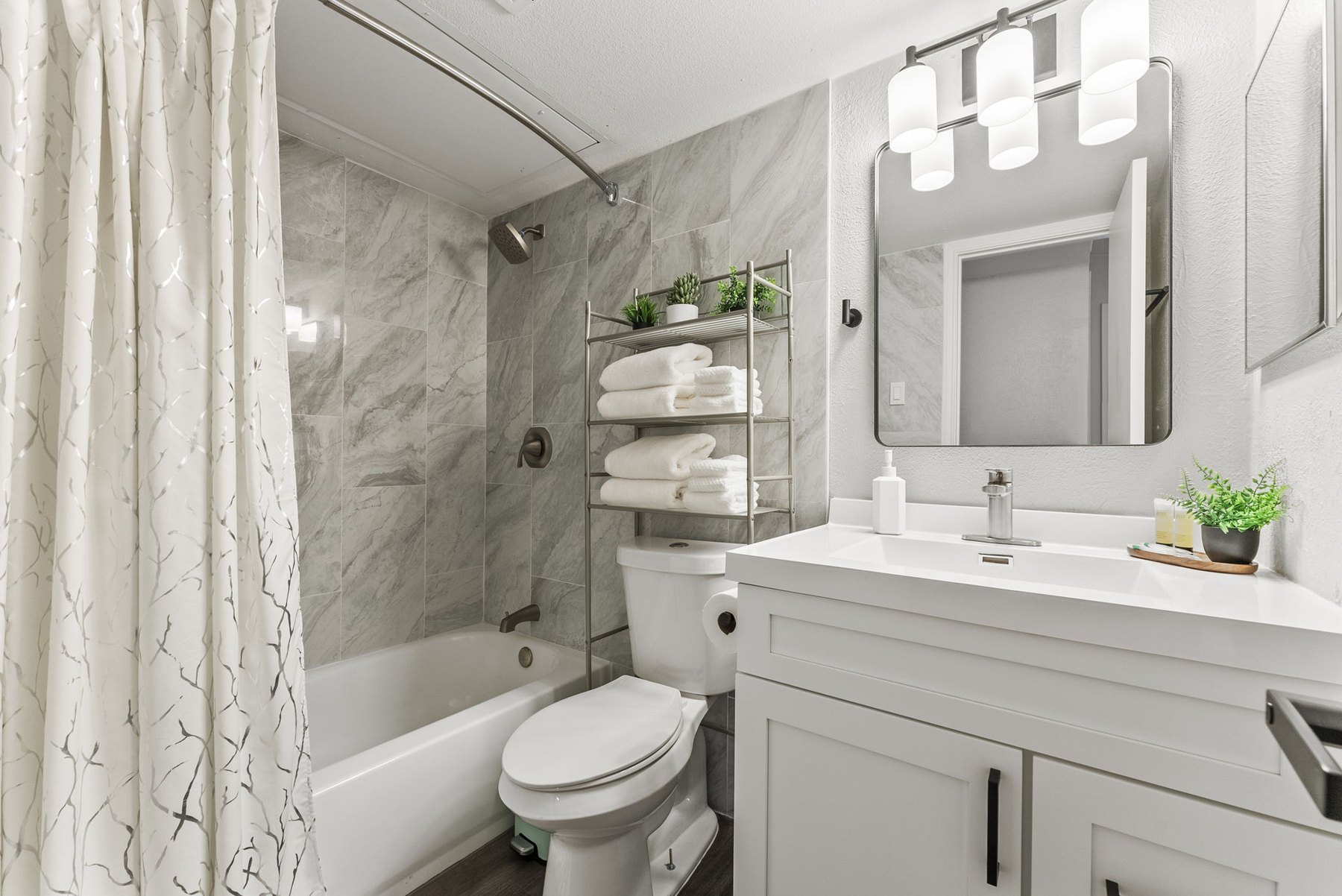 Full bathroom with shower and tub at The Modern Boho
