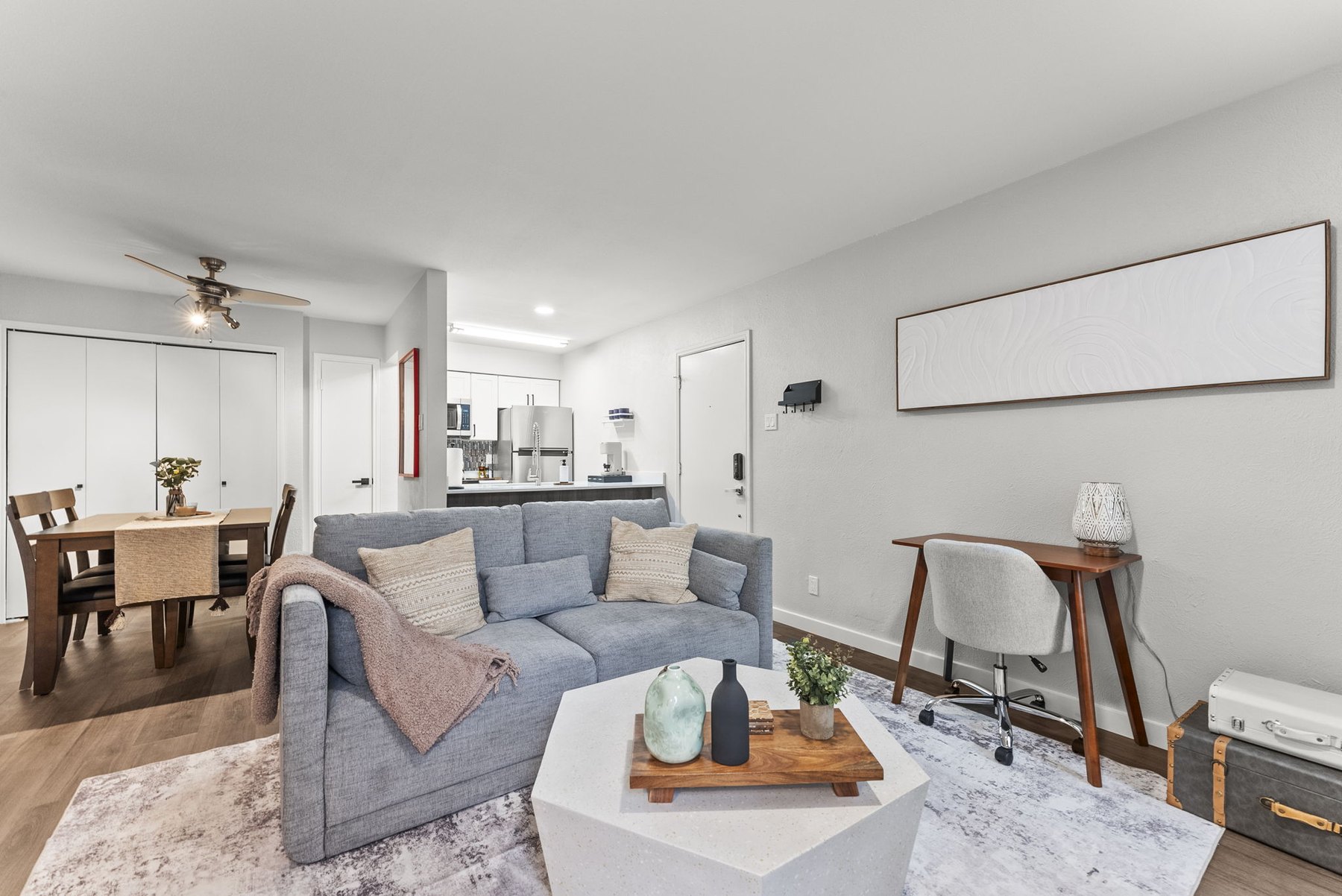 Living room with dedicated workspace at The Modern Boho
